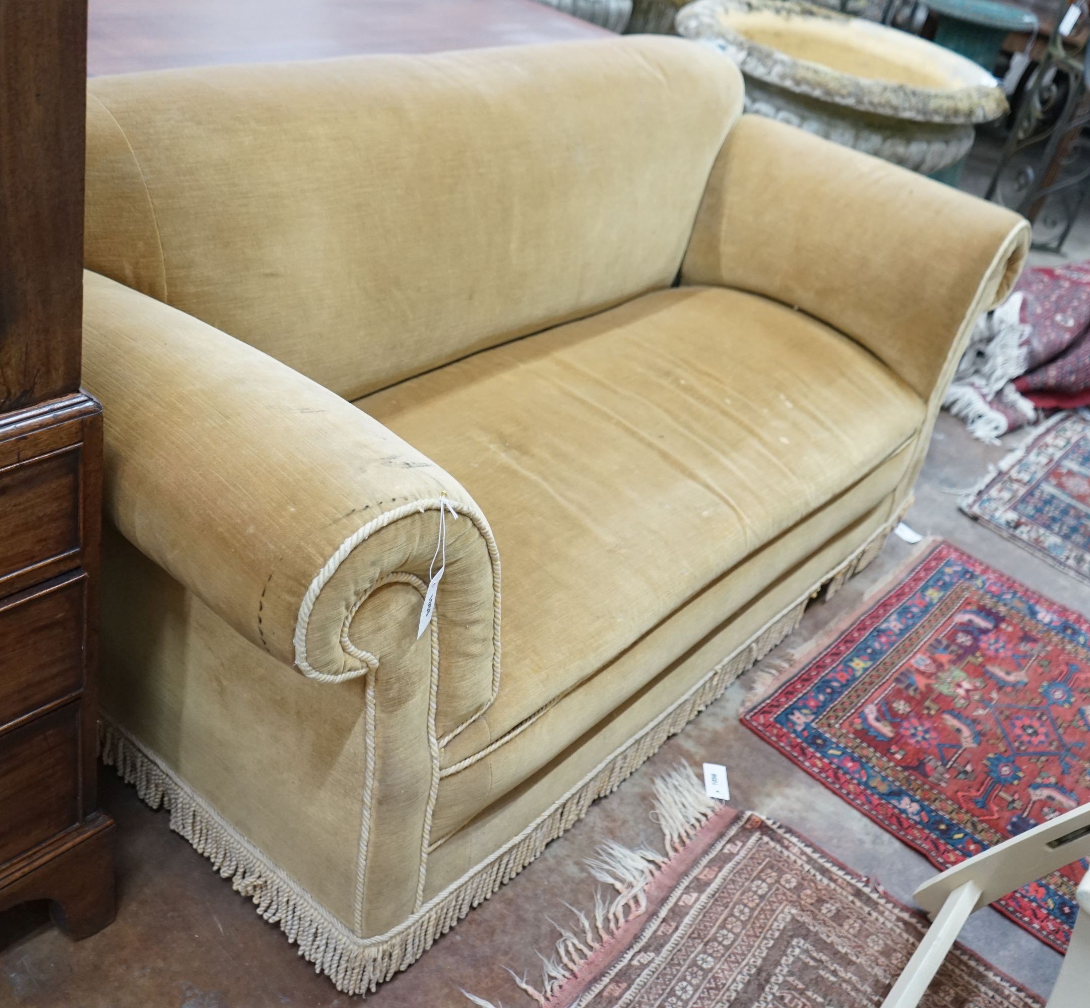 An early 20th century drop arm Chesterfield settee upholstered in gold dralon, operating handle with ivorine plaque marked “Patent 18092 1901” length 190 cm depth 77 cm height 82 cm.